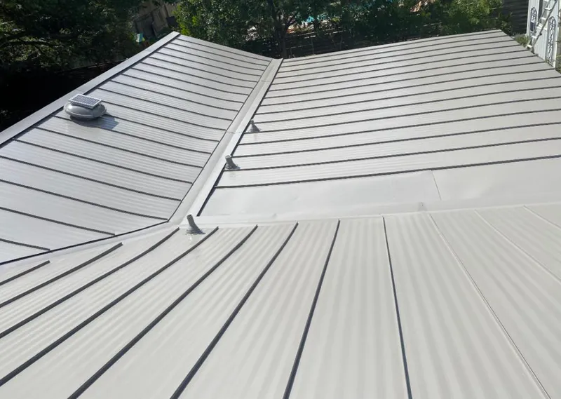 Solar attic fan installed on a metal roof for Roof Ventilation in Floral City